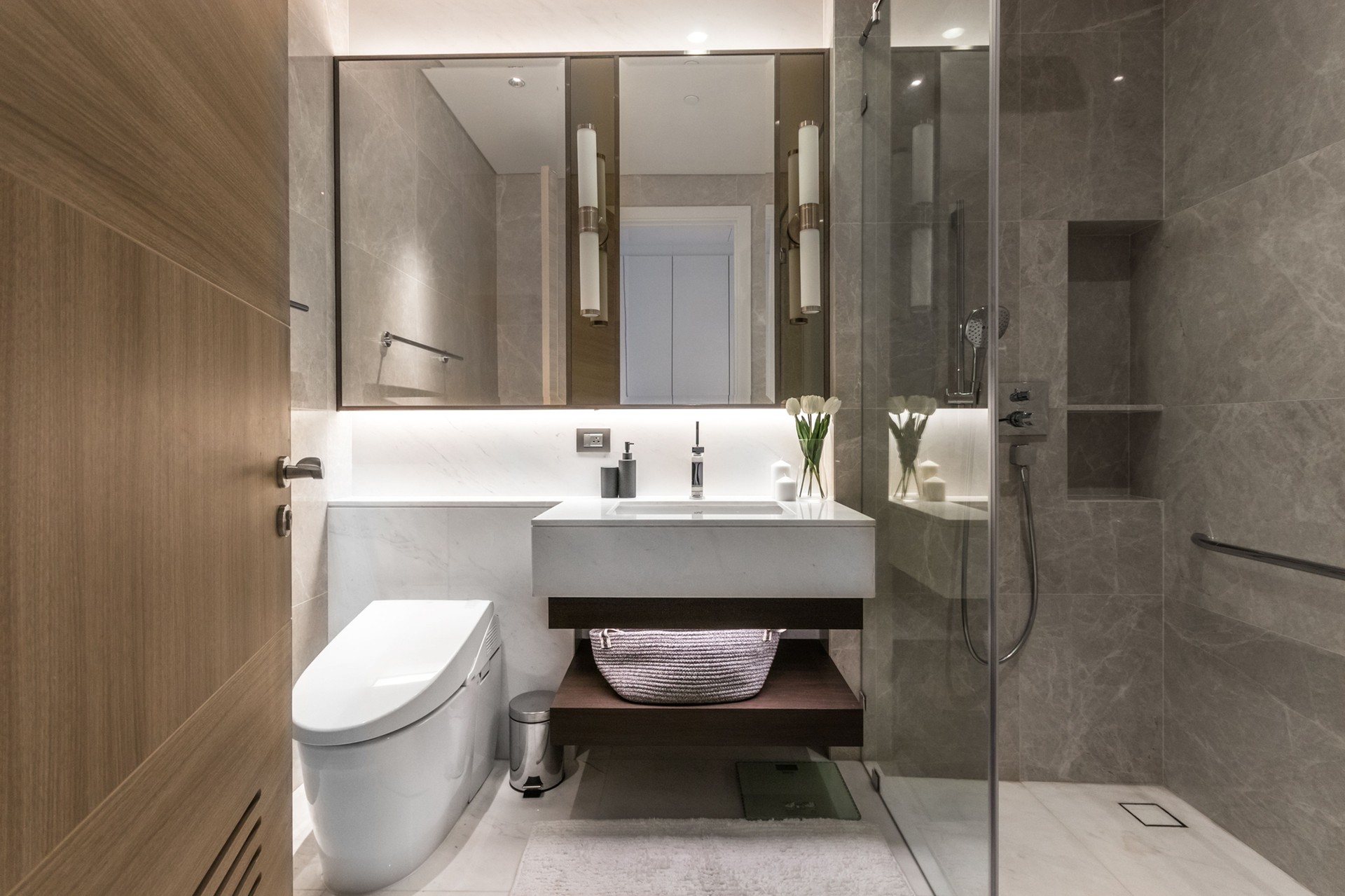 Clean and white bathroom with amenities.